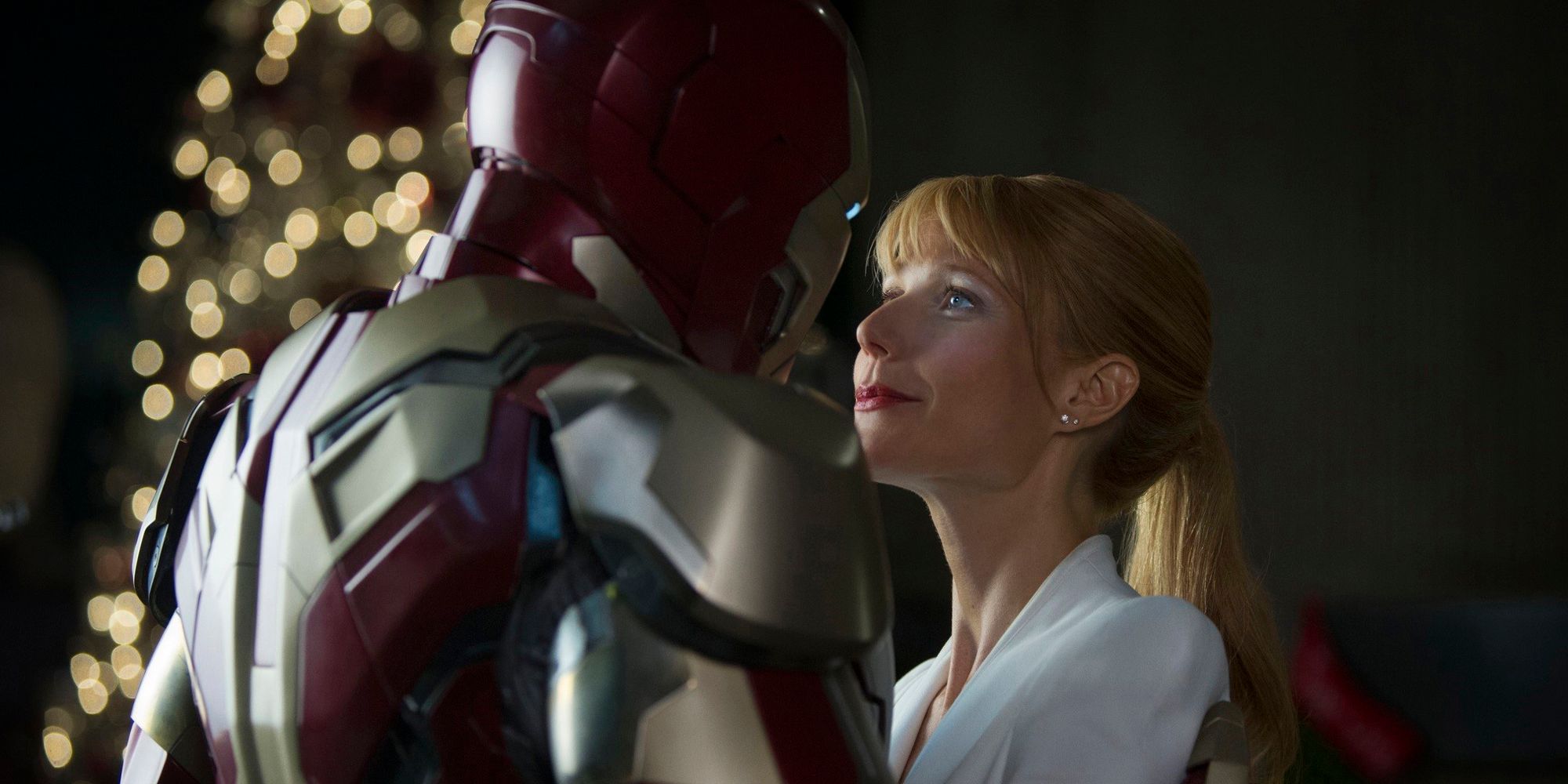 Pepper Potts Getting Close With Iron Man in Front of Christmas Tree in Iron Man 3