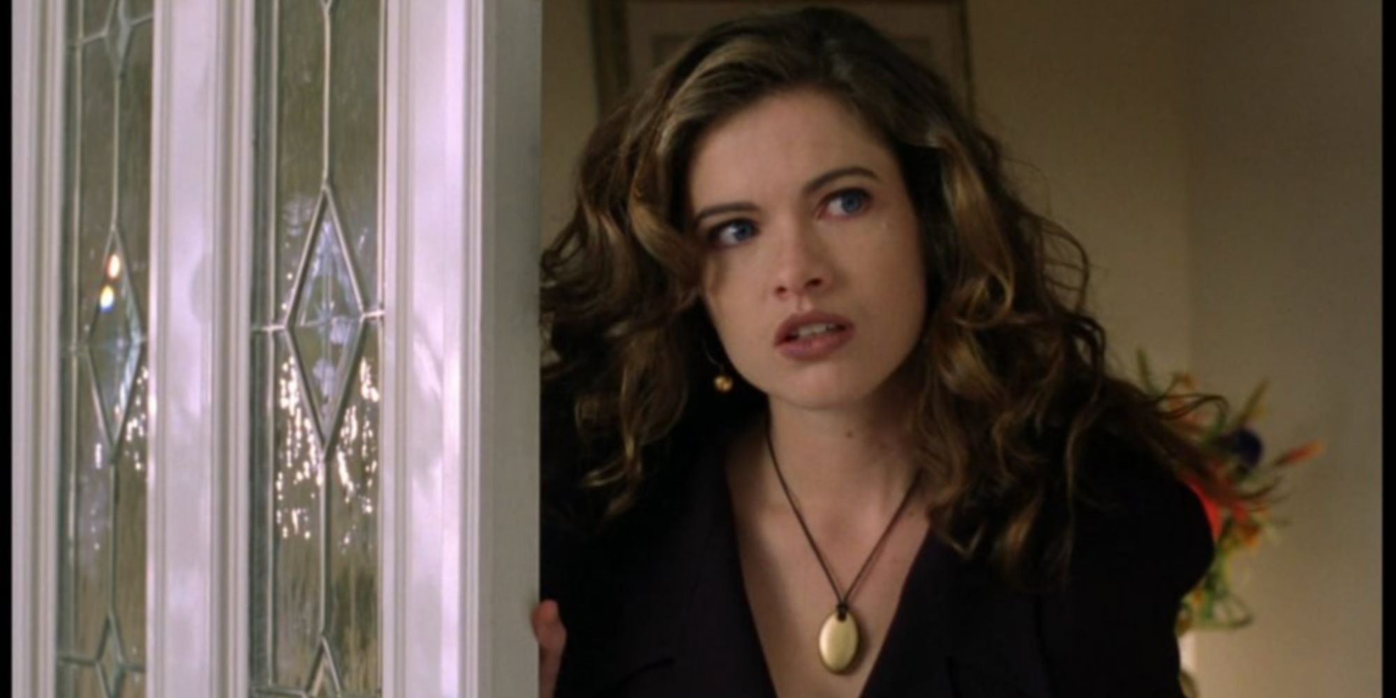 Heather Langenkamp as herself walking out of a door in Wes Craven’s New Nightmare.