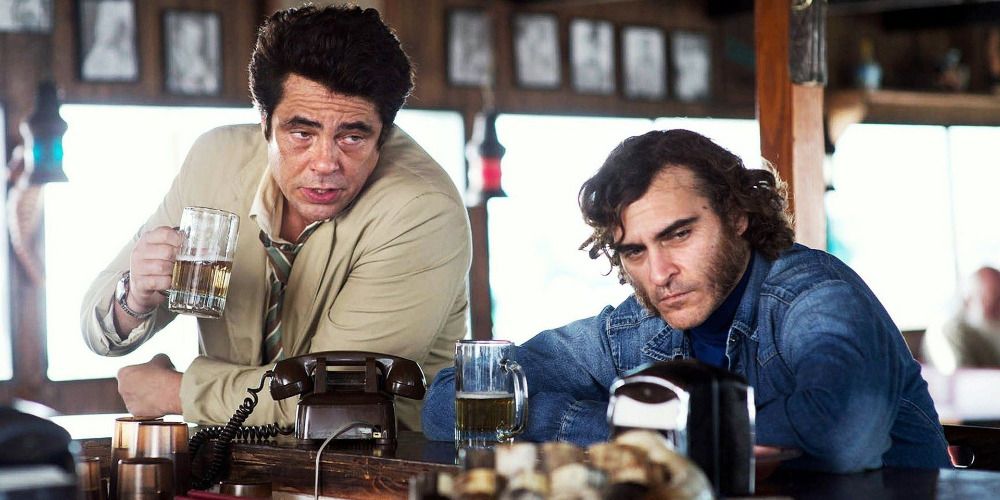 Benicio Del Toro and Joaquin Phoenix at a bar drinking in Inherent Vice