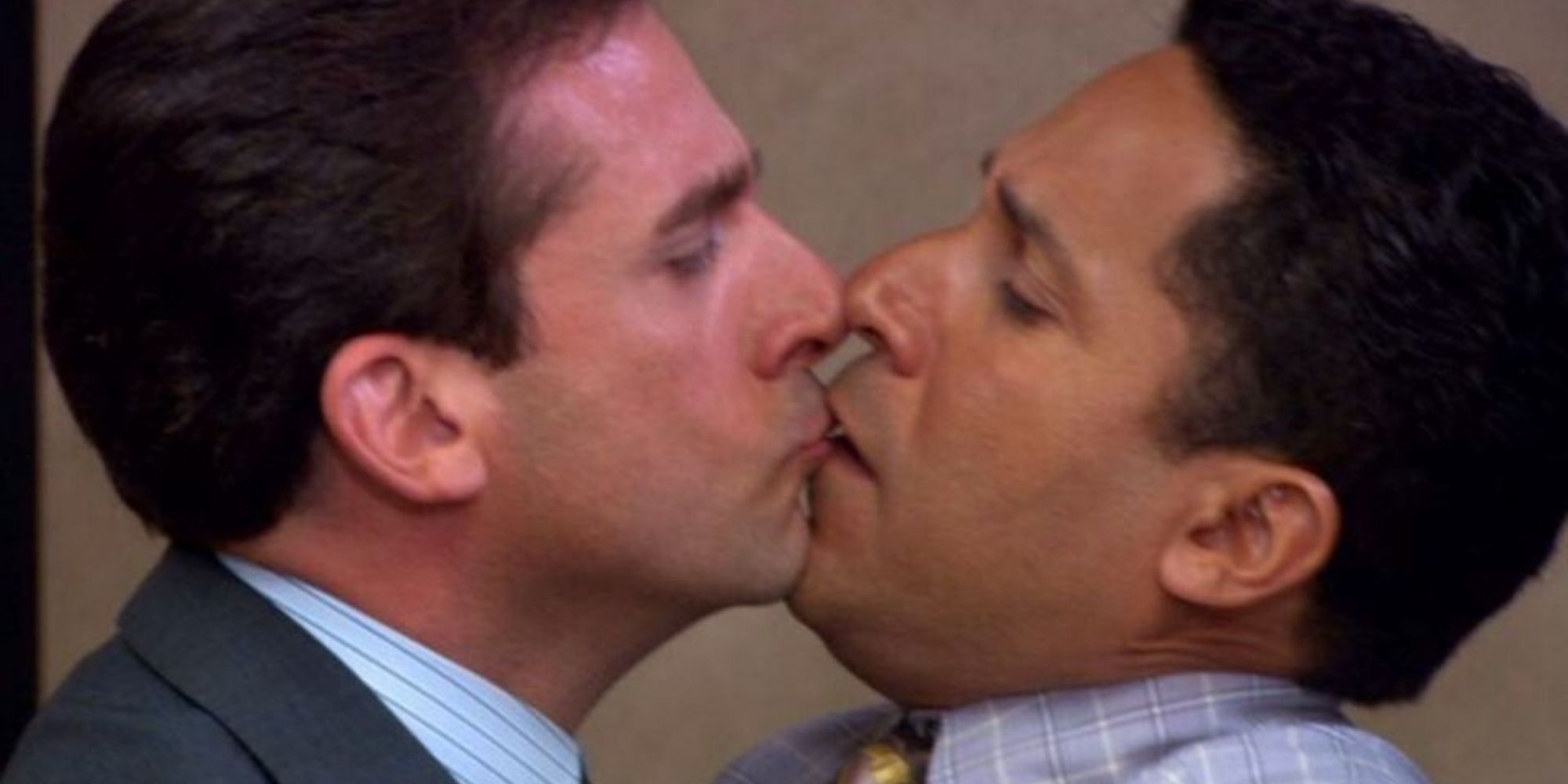 Michael Scott kissing Oscar Nunez on The Office