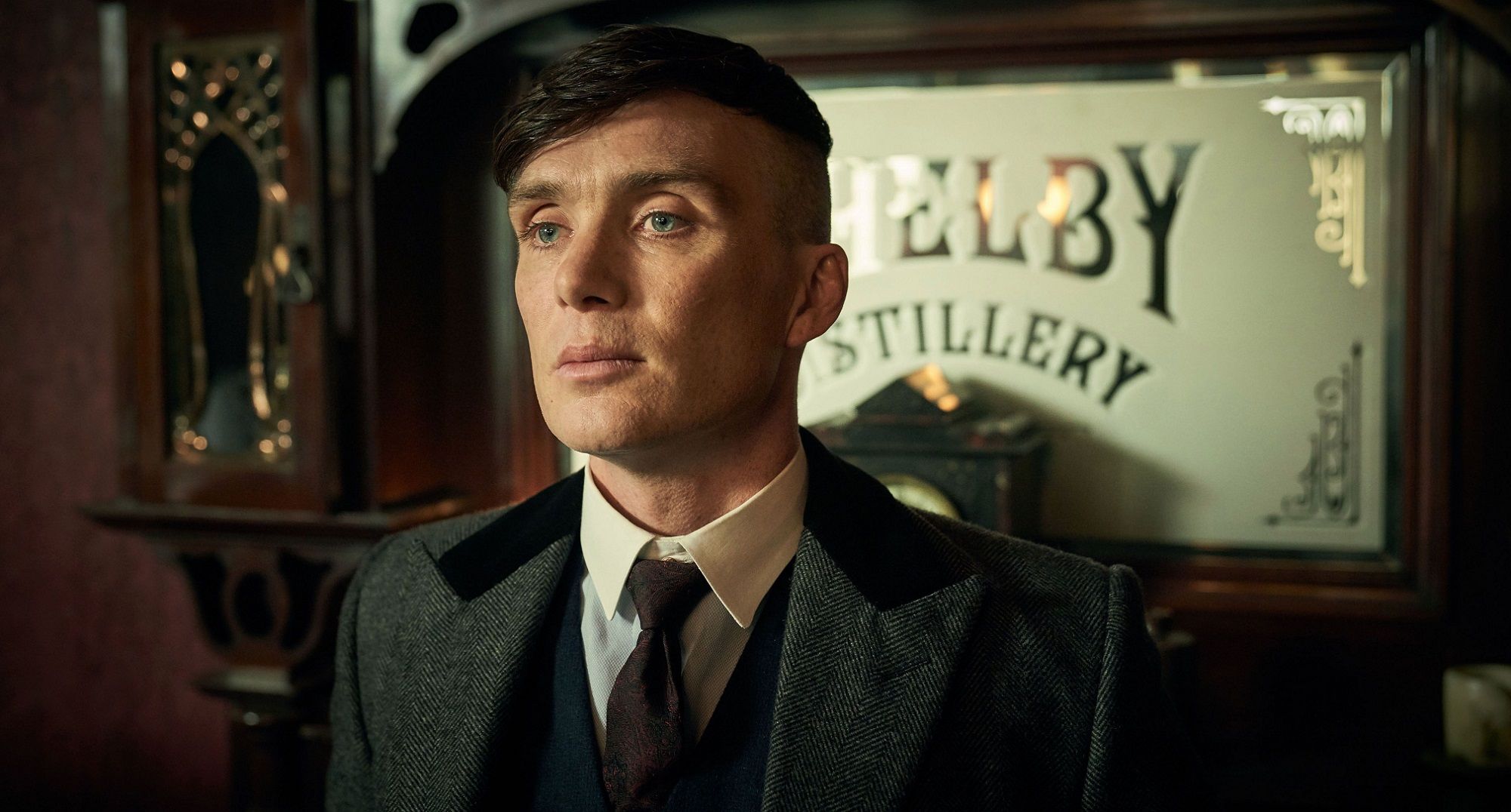 Peaky Blinders Tommy Shelby standing in front of a door