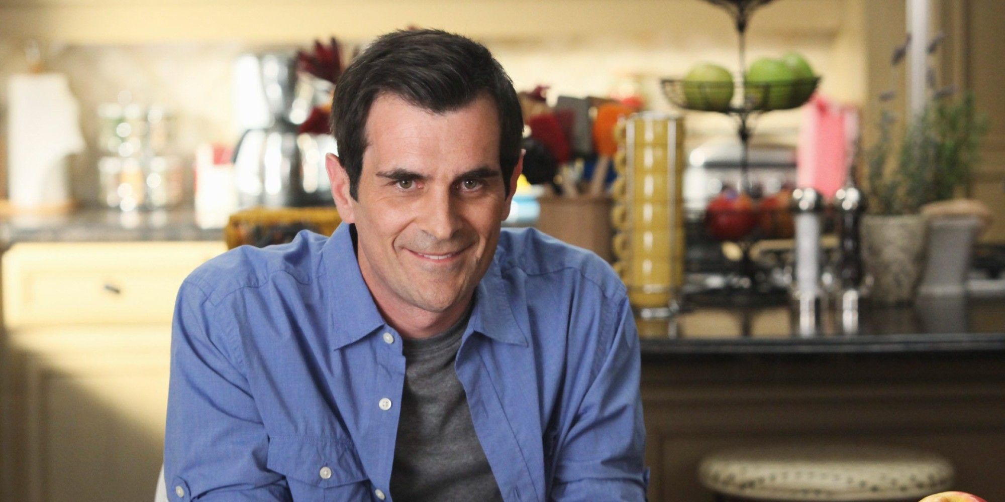 Ty Burrell as Phil Dunphy smiling directly at the camera in Modern Family