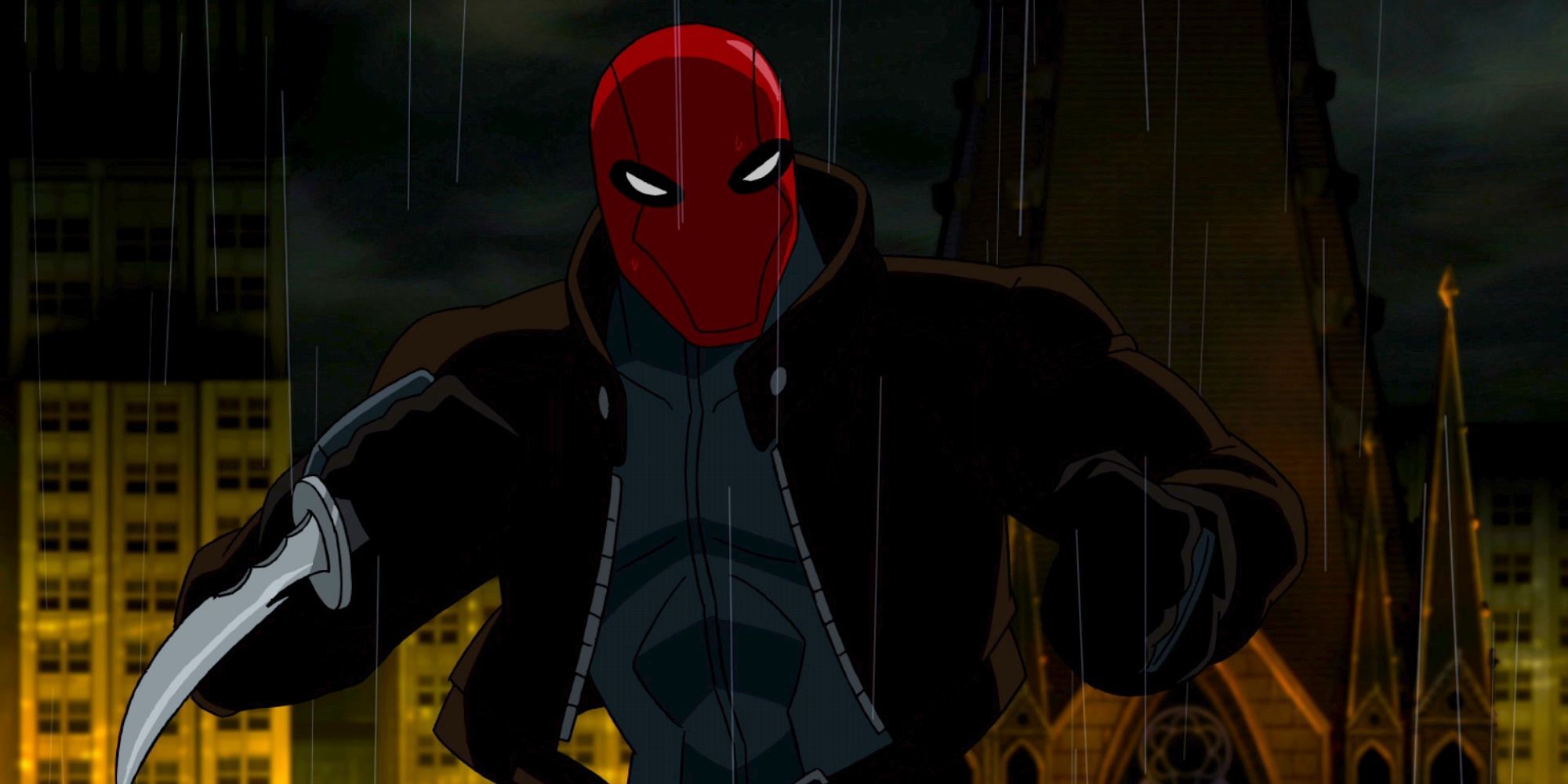 Red Hood under the rain fighting while holding a knife in Batman: Under the Red Hood