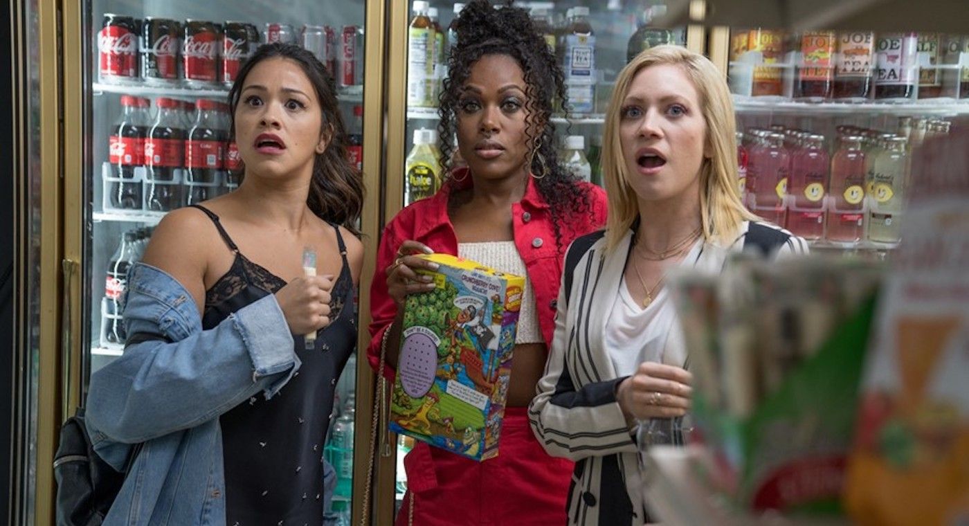 Gina Rodriquez, DeWanda Wise, and Brittany Snow as Jenny, Erin, and Blair in a store in Someone Great