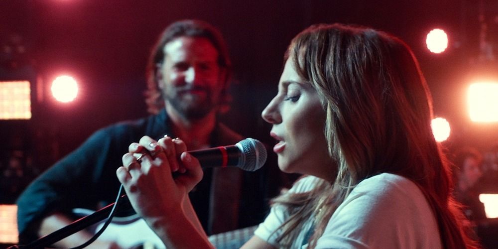 Bradley Cooper and Lady Gaga as Jackson and Ally performing Shallow on stage in Star is Born