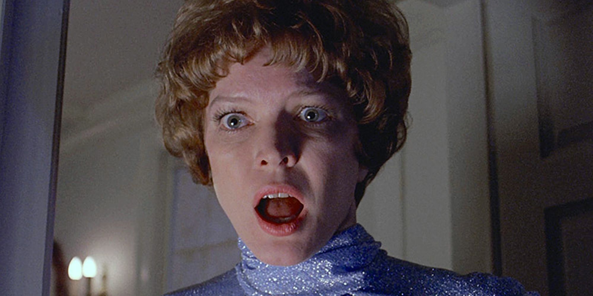 Ellen Burstyn as Chris McNeill opening her mouth in horror in the film The Exorcist.
