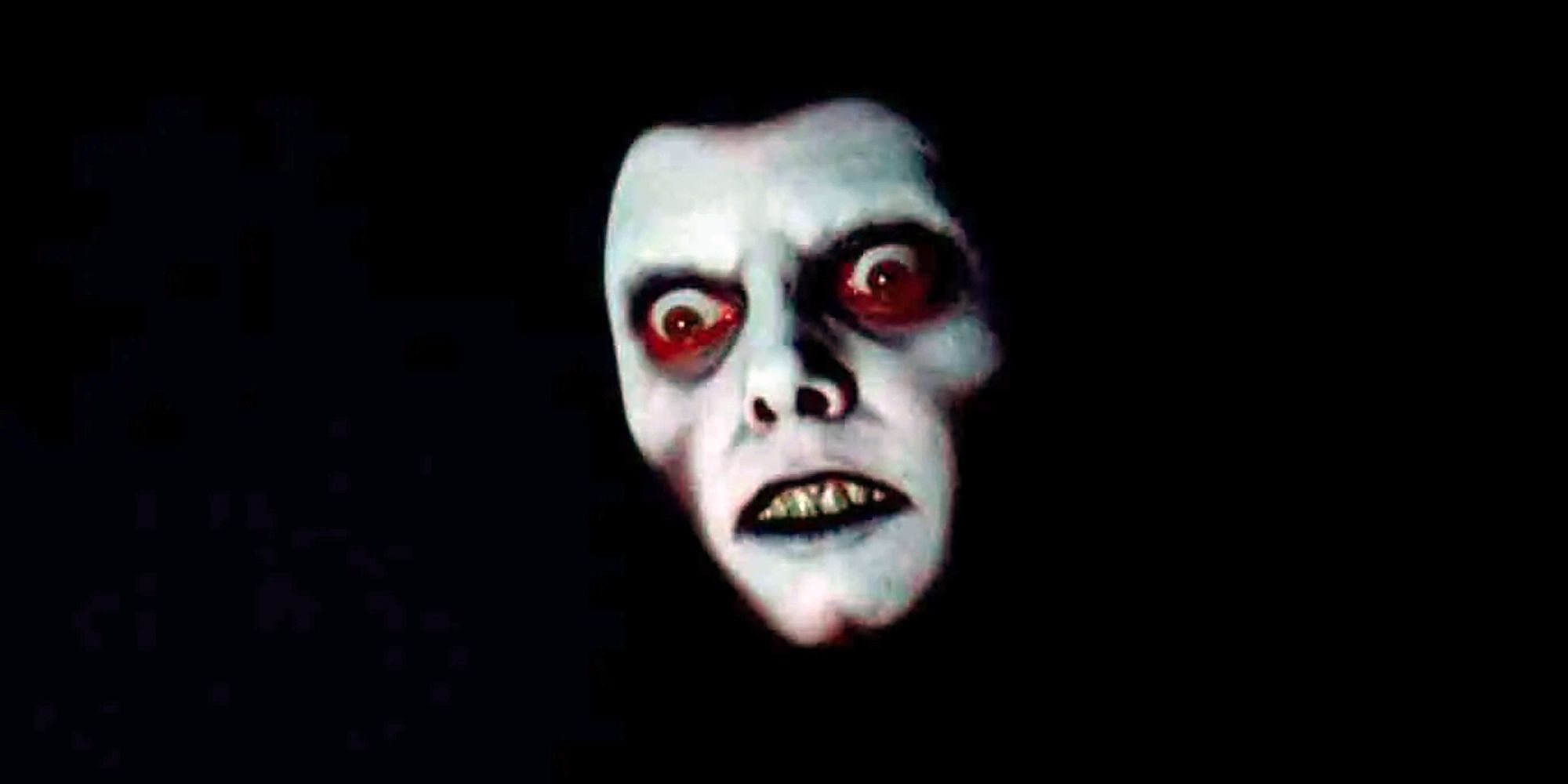 The demon Pazuzu's face emerging from the dark in The Exorcist.