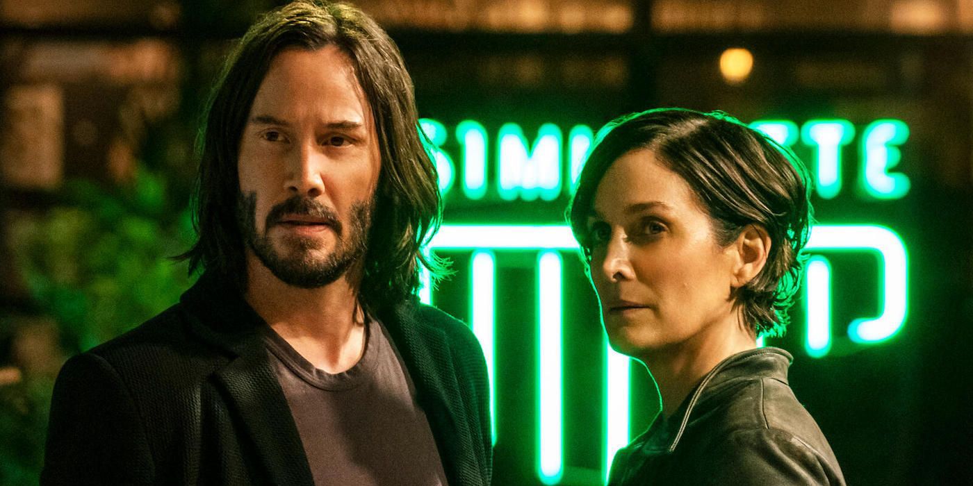 Keanu Reeves and Carrie-Anne Moss as Neo and Trinity looking in the same direction in The Matrix Resurrections