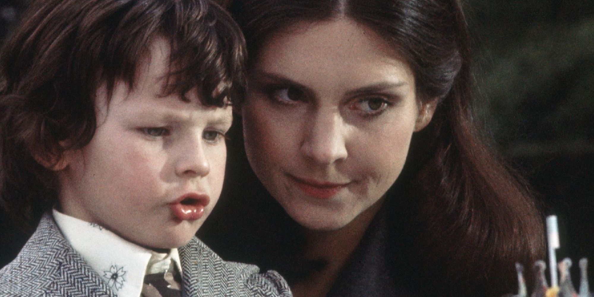 The Omen - Damien and Nanny looking at birthday cake