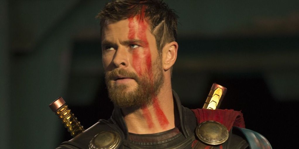 Thor With Red War Paint On Cheek inside an arena in Thor: Ragnarok.