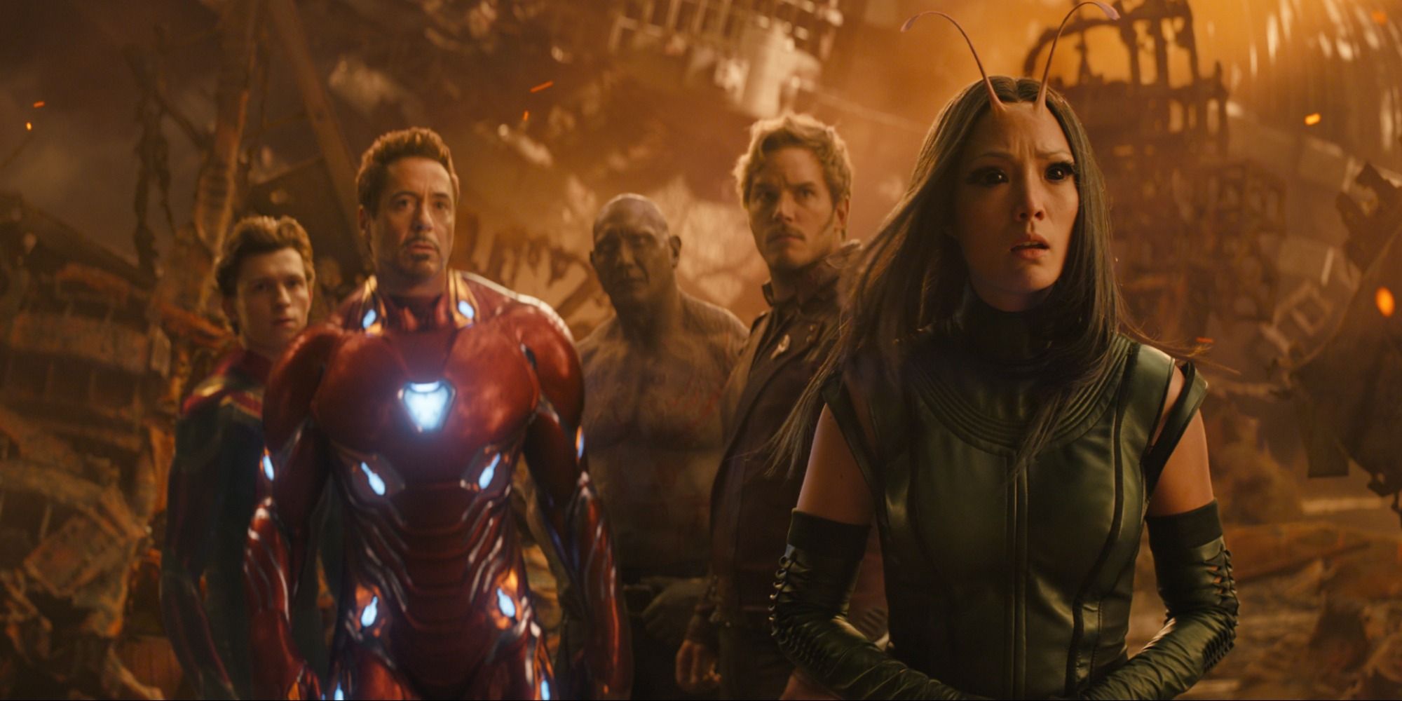 Spider-Man, Iron Man, Drax, Star Lord and Mantis looking at Thanos on Titan