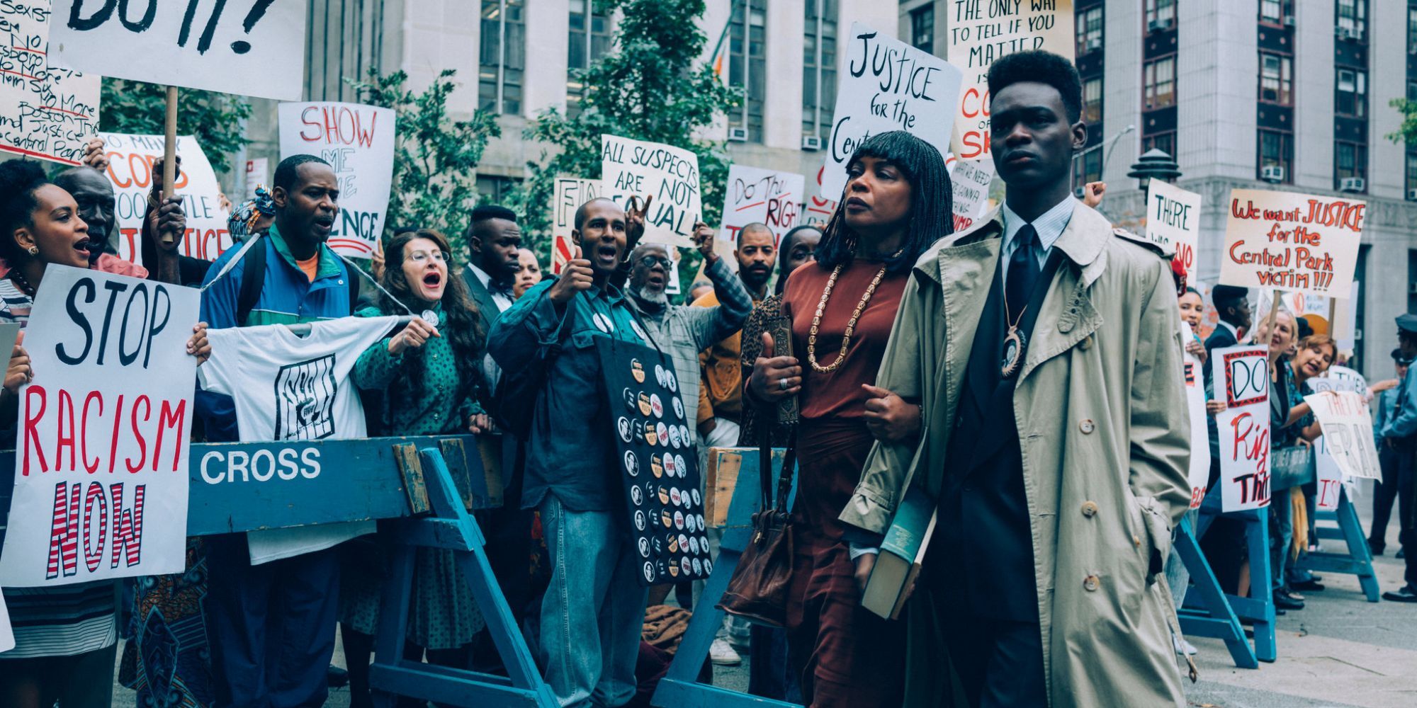 Yusef Salaam is led into court while anti-racism protesters support him. courtesy netflix