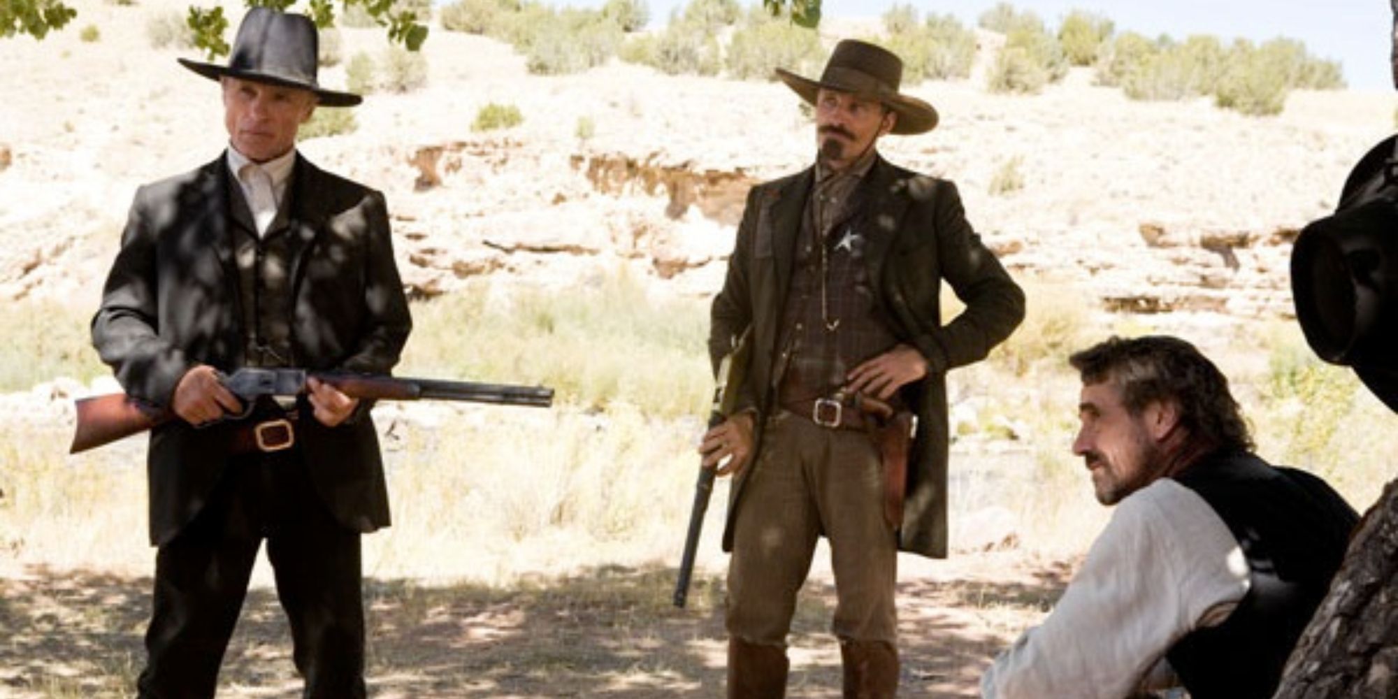 Ed Harris and Viggo Mortensen standing together in a desert in 'Appaloosa'