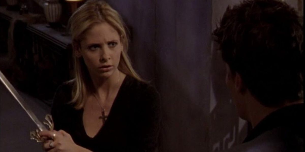 Sarah Michelle Gellar as Buffy holding a sword