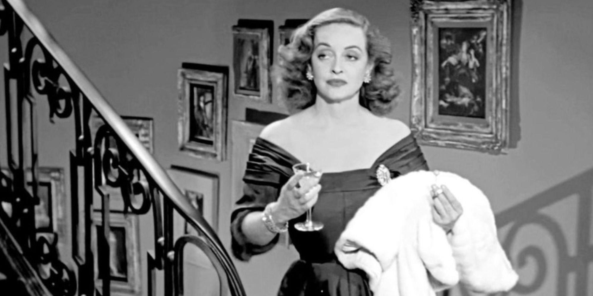 Bette Davis as Margo Channing toasting in All About Eve.
