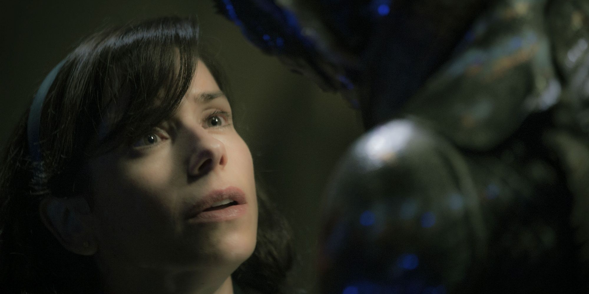 Elisa Esposito stares up at The Amphibian Man in The Shape of Water