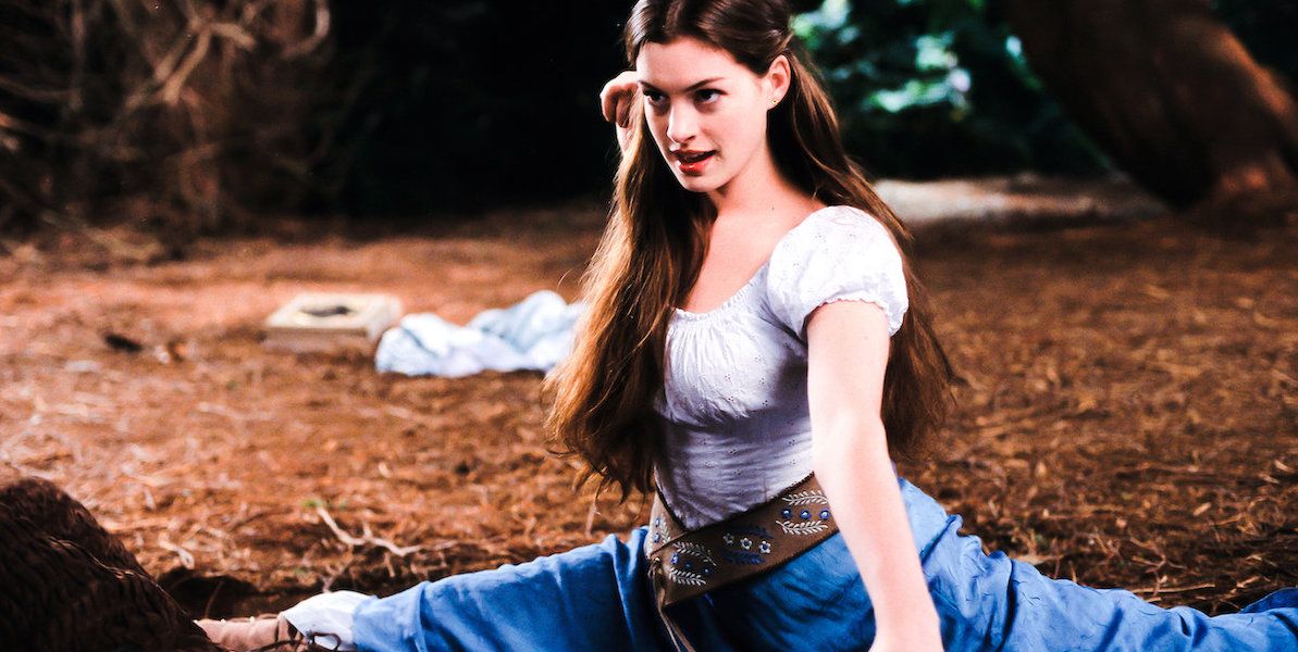 Anne Hathaway as Ella Enchanted doing the splits in the woods