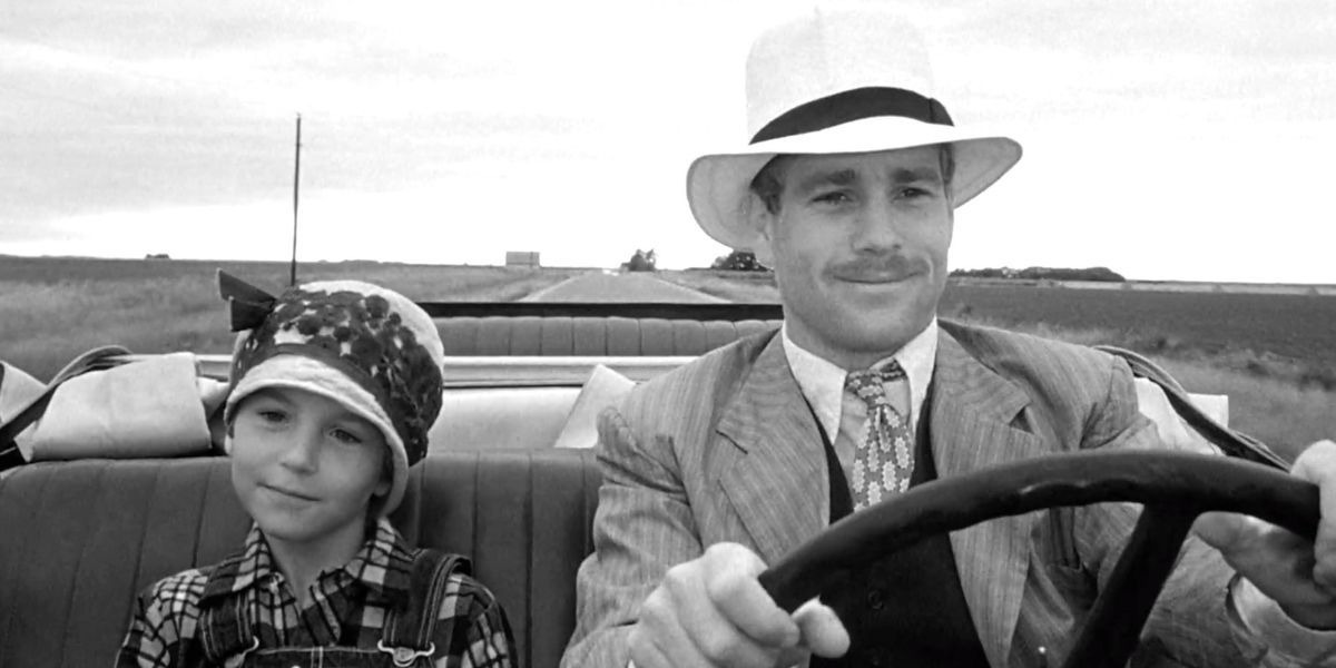 Tatum O'neal and Ryan O'neal driving in Paper Moon