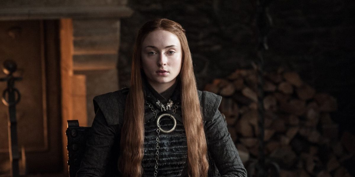 sophie turner as sansa stark sitting down in game of thrones