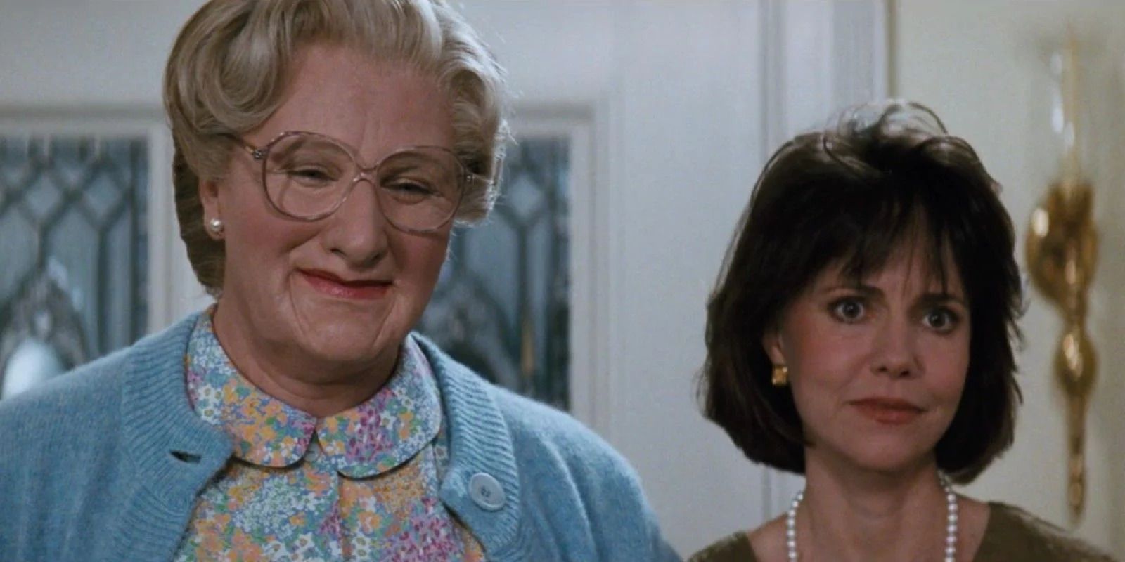 Robin Williams as Mrs. Doubtfire and Sally Fields as Miranda Hillard in Mrs. Doubtfire