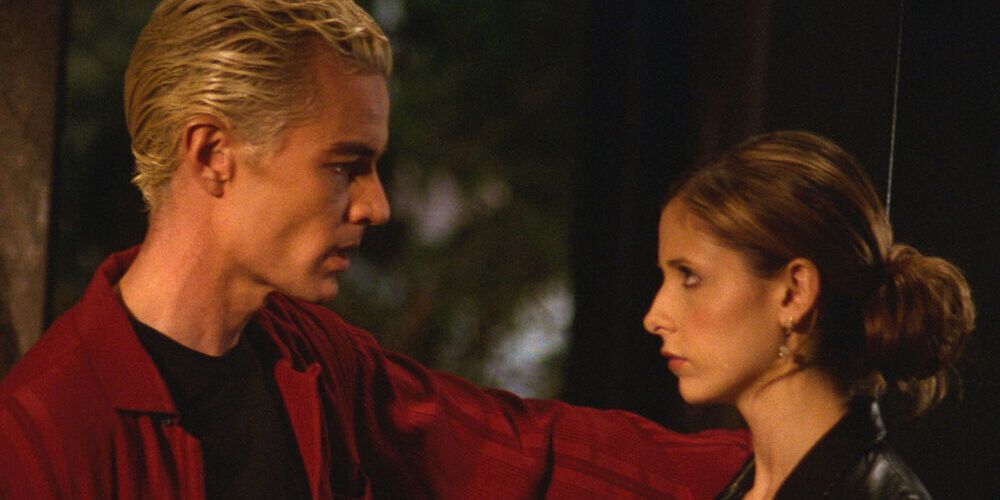 Buffy and Spike standing outside in an alleyway from the episode Once More, With Feeling
