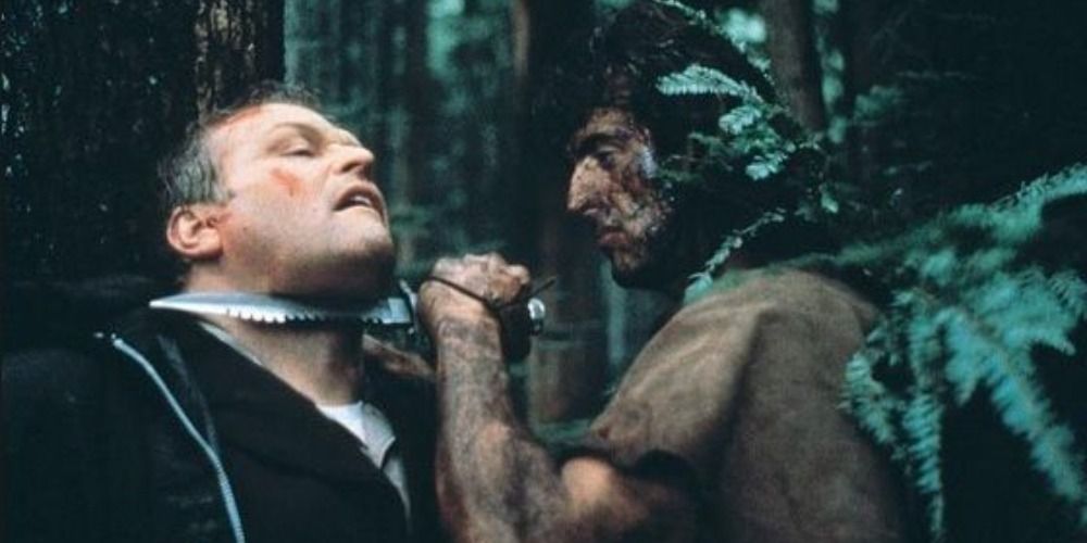 Sylvester Stallone holding a knife to Brian Dennehy's throat in First Blood