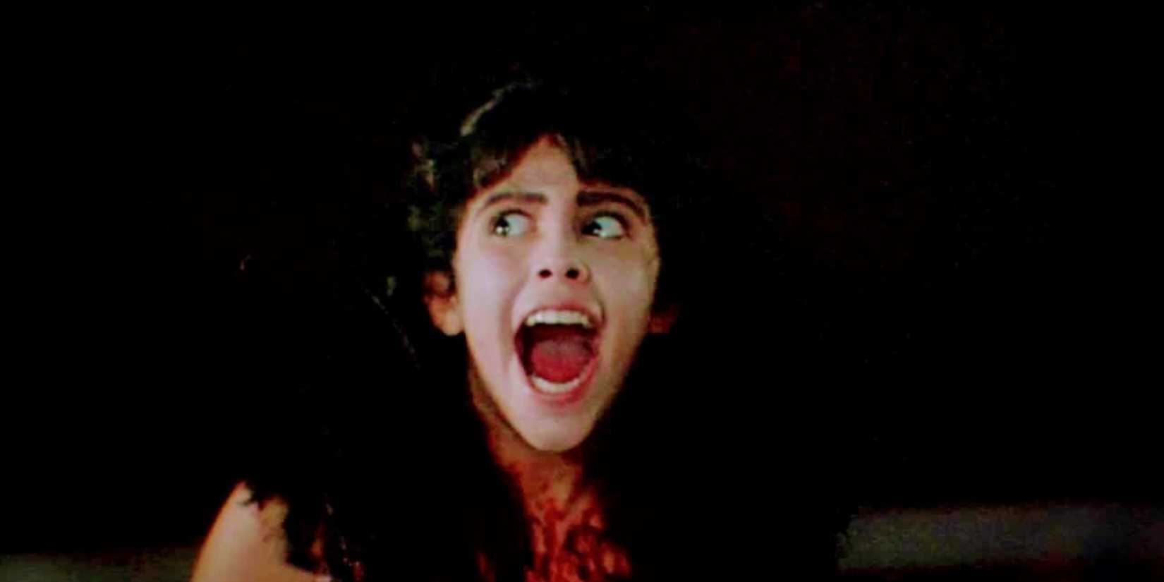 Angela yelling with wide eyes in Sleepaway Camp.