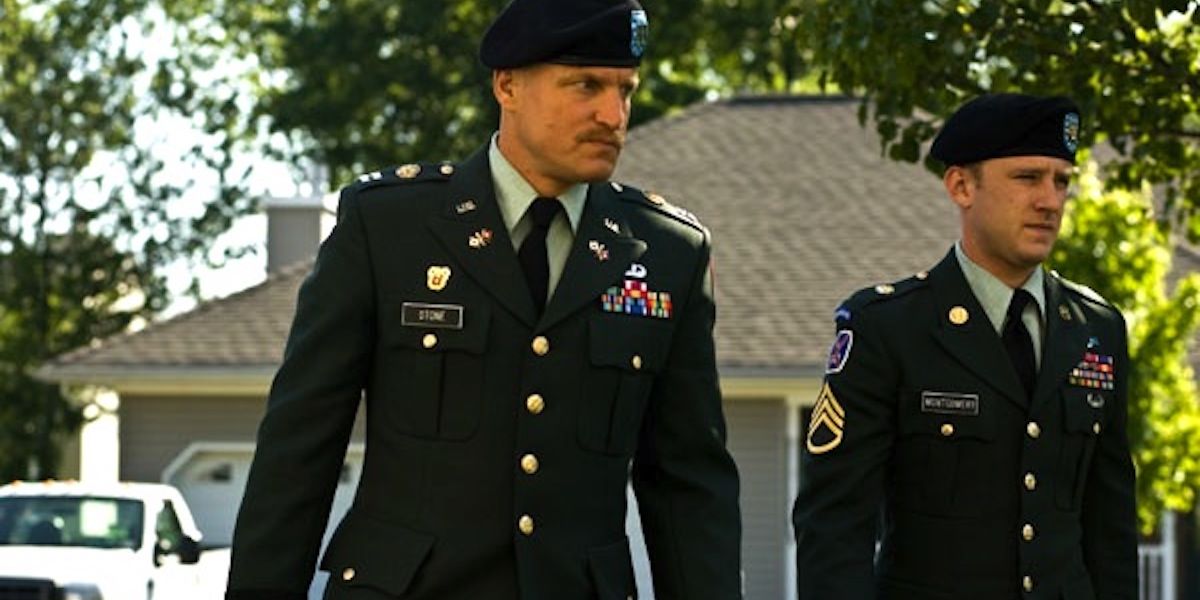 An official screenshot of Ben Foster and Woody Harrelson walking in military uniforms