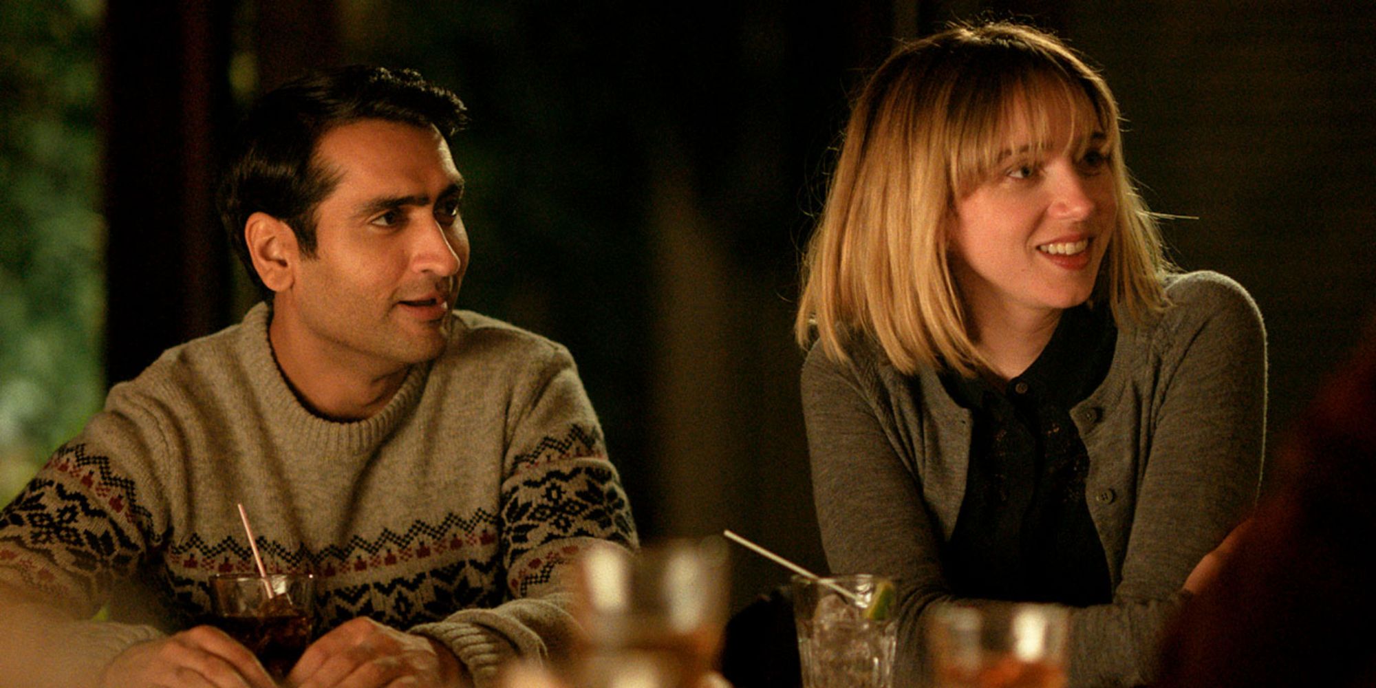 Kumail and Emily at a dinner party in 'The Big Sick'.