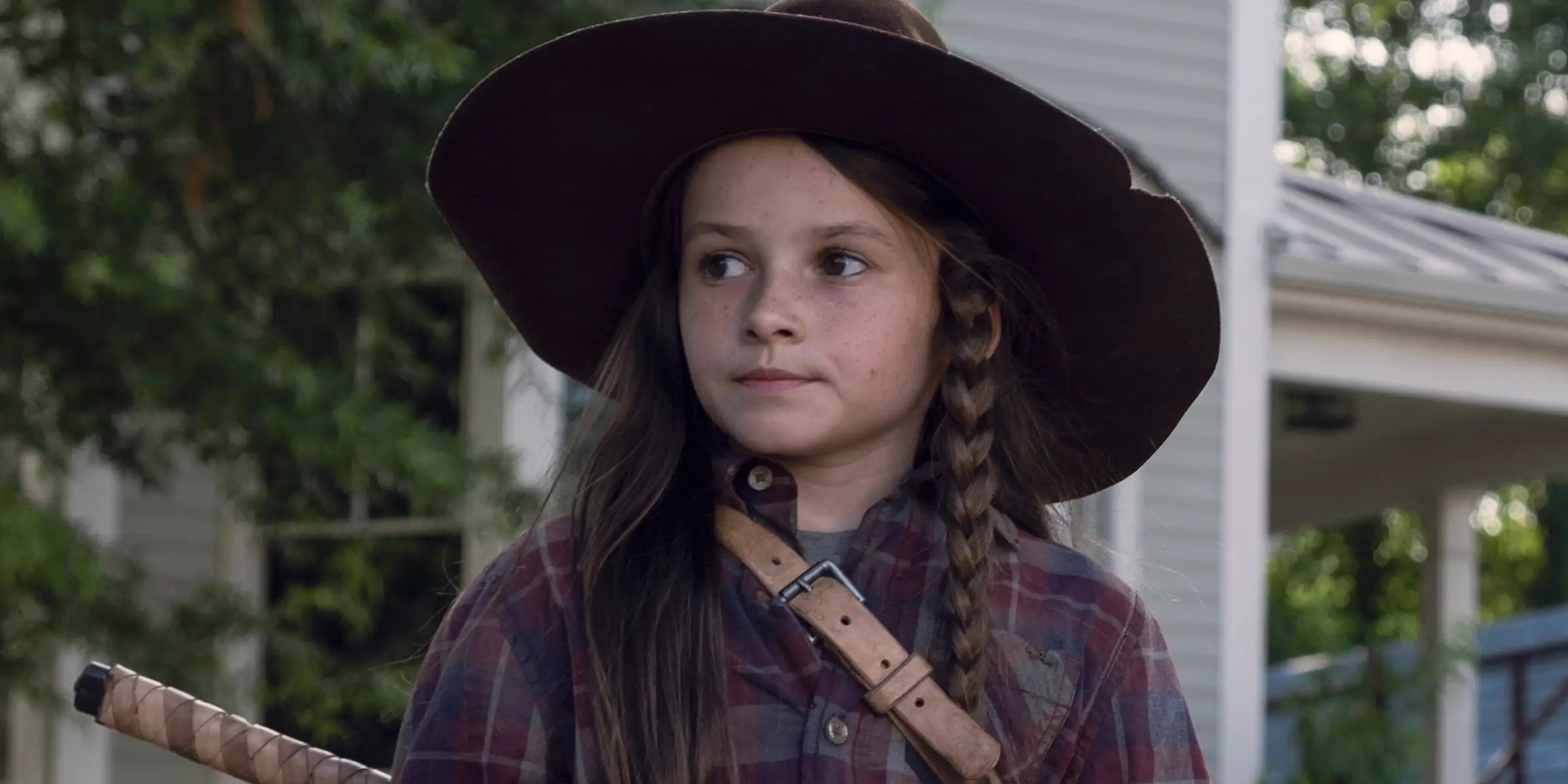 Judith Grimes wears her father's hat as she walks through Alexandria in 'The Walking Dead'