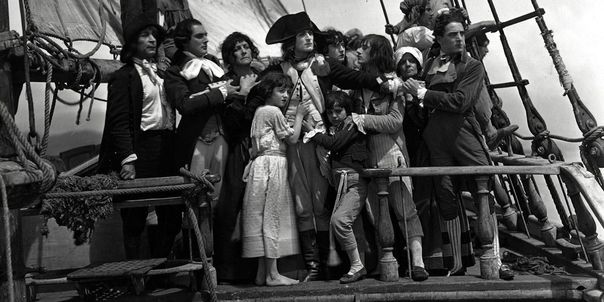 Napoleon, surrounded by the crew of his ship, in Abel Gance's "Napoleon"