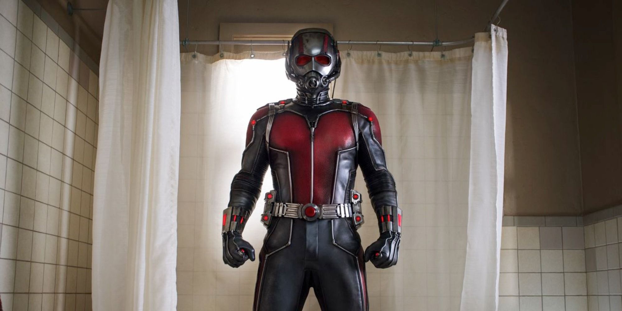 Ant-Man in his suit standing in the shower 