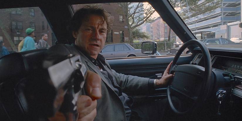 The Lieutenant aiming his gun at someone off-camera in Bad Lieutenant