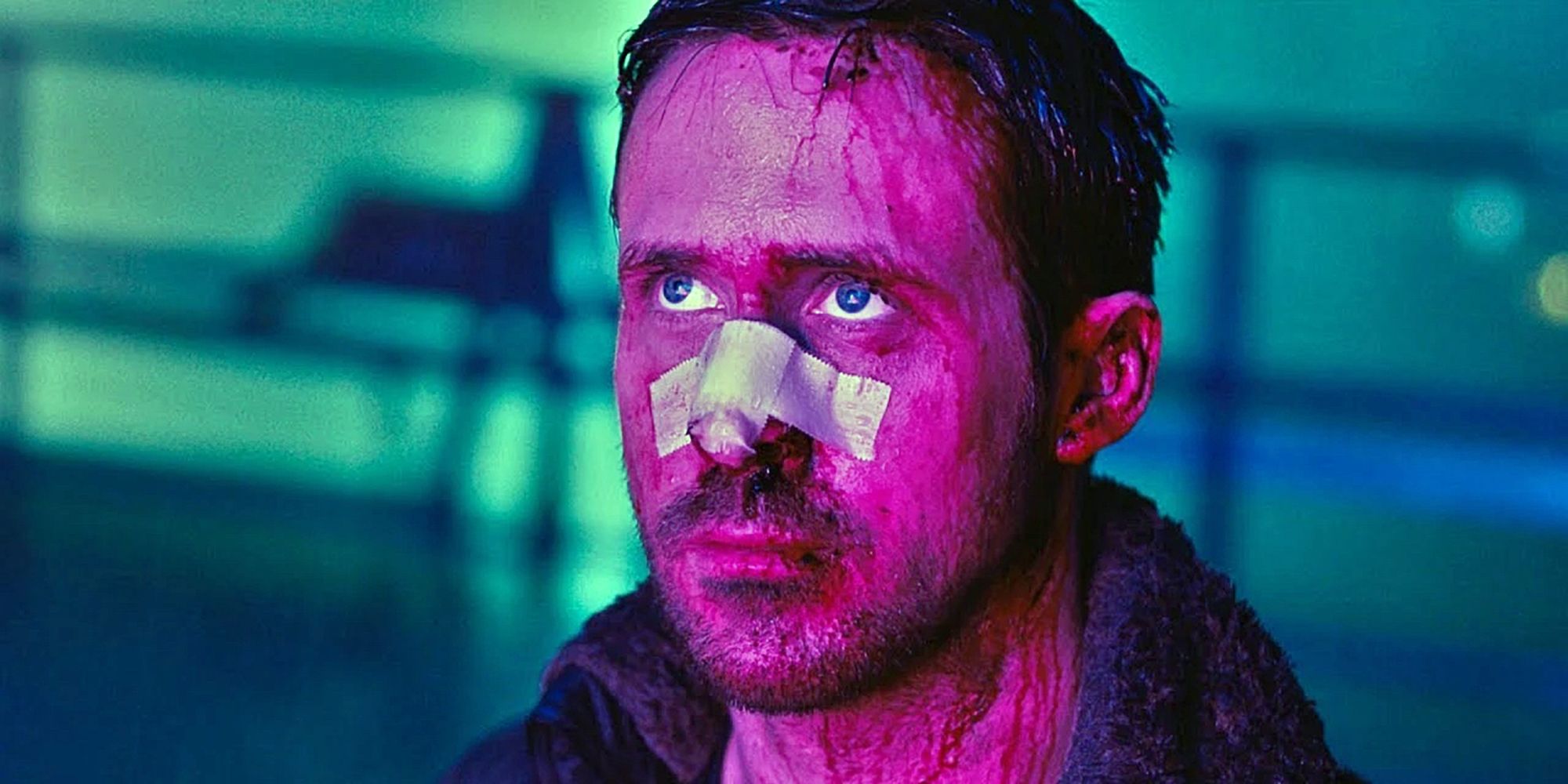 A wounded Ryan Gosling drenched in neon in Blade Runner 2049