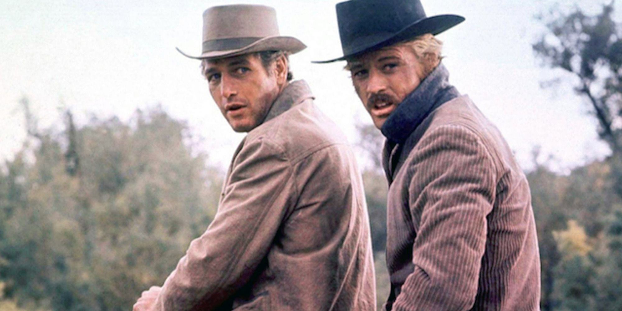 Paul Newman as Cassidy and Robert Redford as Sundance on horseback turning to face the camera in Butch Cassidy and the Sundance Kid