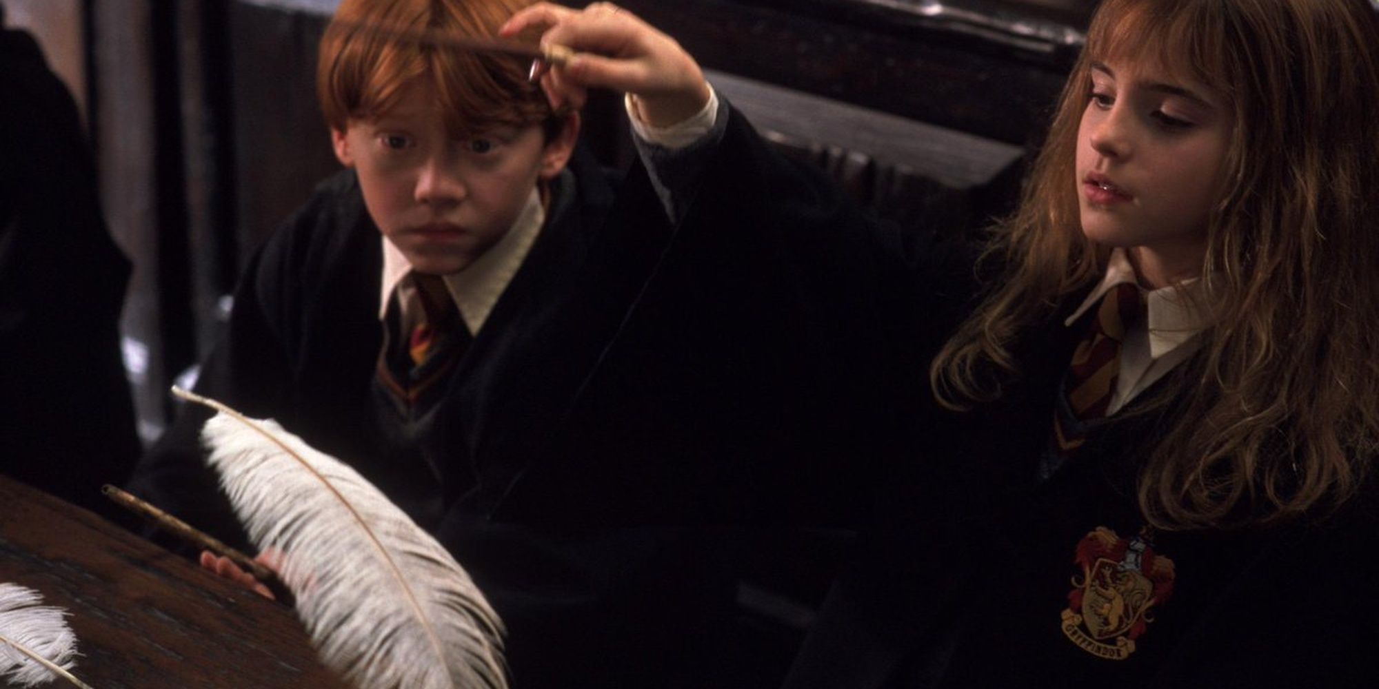 Hermione and Ron in class learning the Levitation Charm