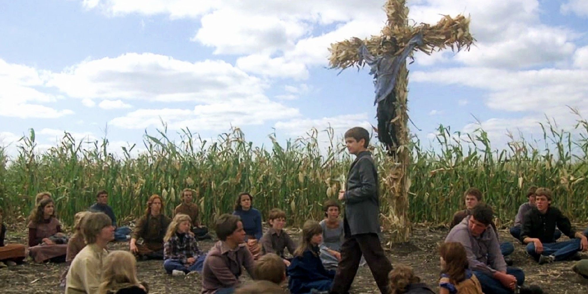 A group of children gathering in a cornfield