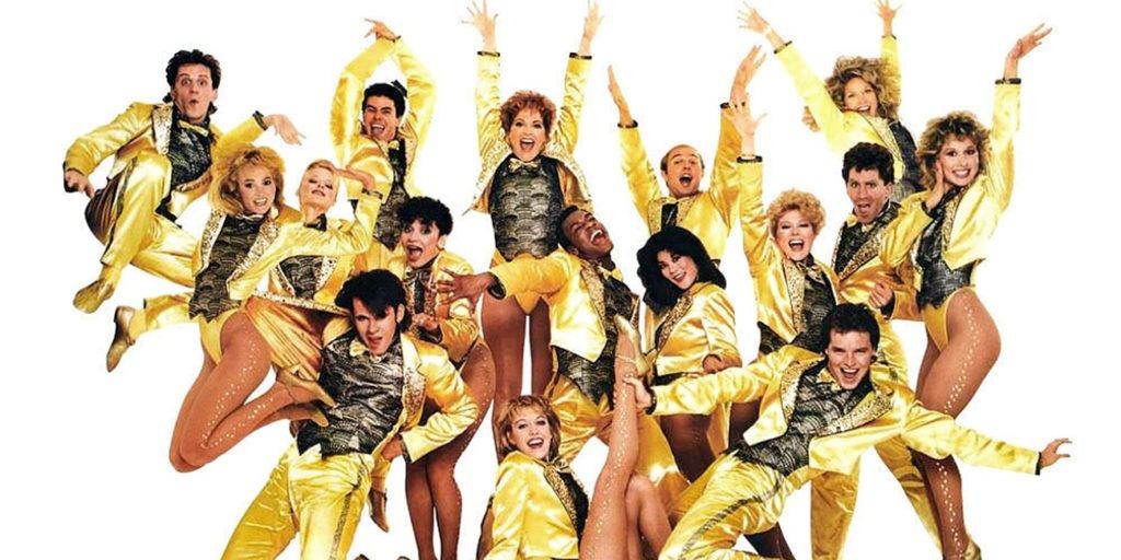 A group of dancers dressed in gold.
