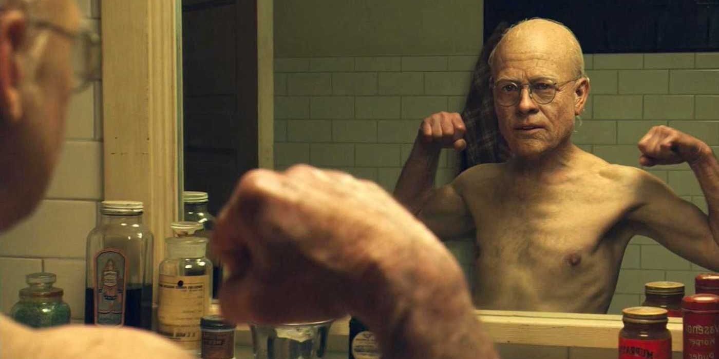 Child Benhamin Button flexes his muscles in the mirror as an old man in 'The Curious Case of Benjamin Button'