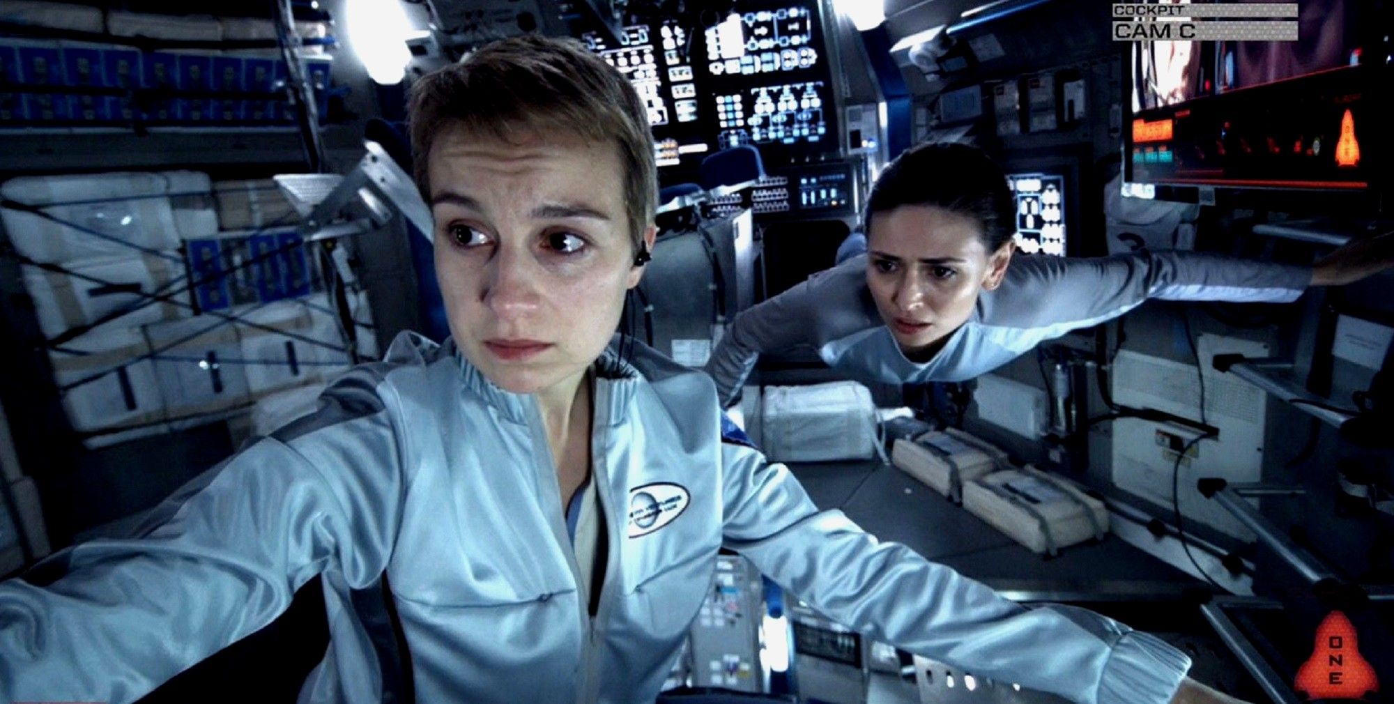 Europa Report - Katya and Rose looking at the spaceship console
