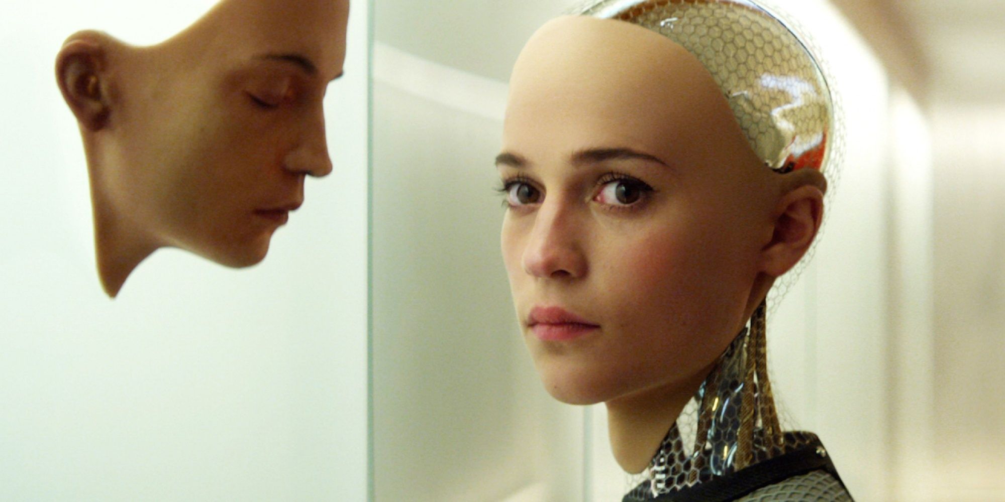 Ava looking at a robot face in Ex Machina.