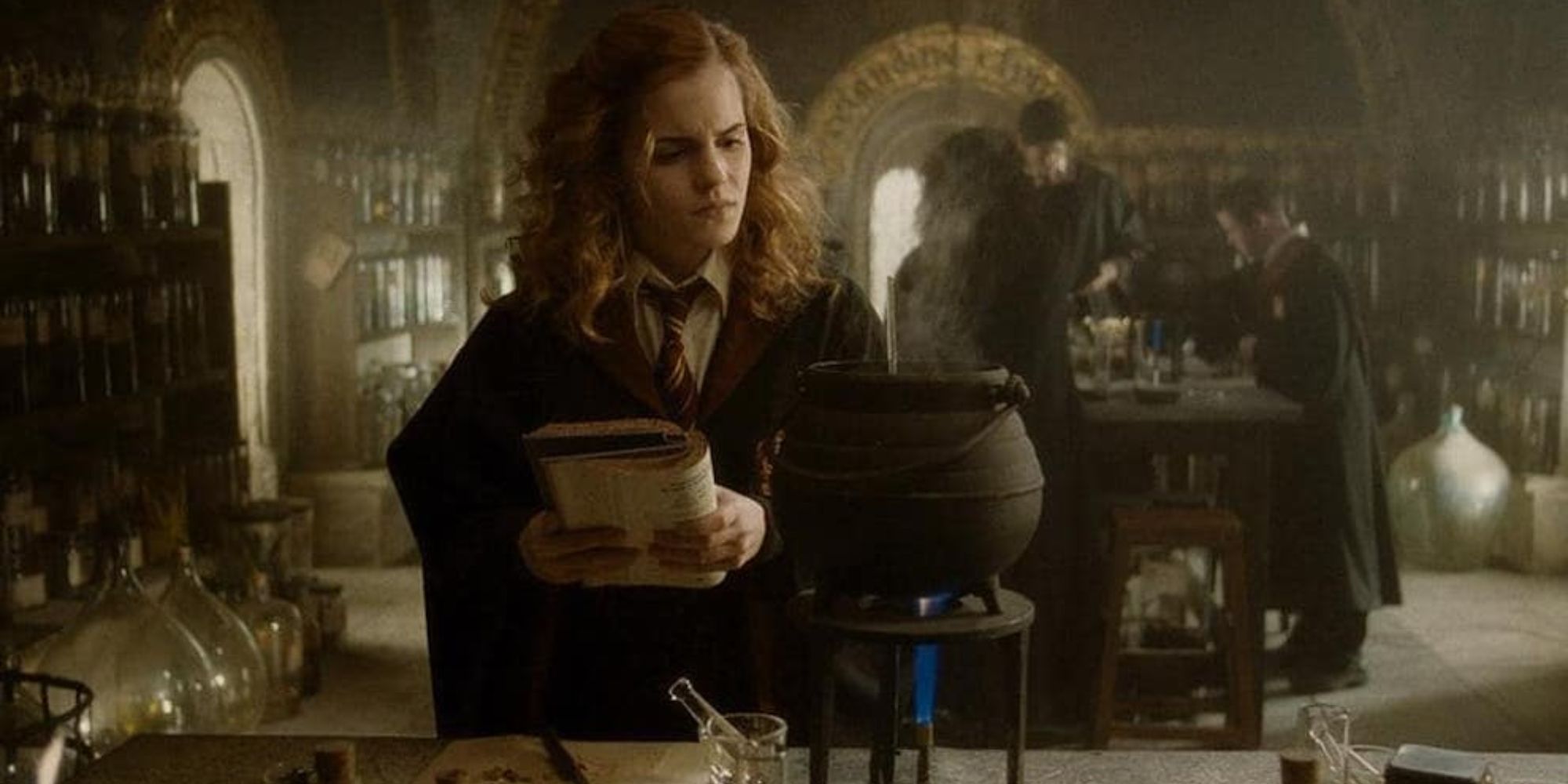 Hermione looks at a potion in confusion while holding instruction book