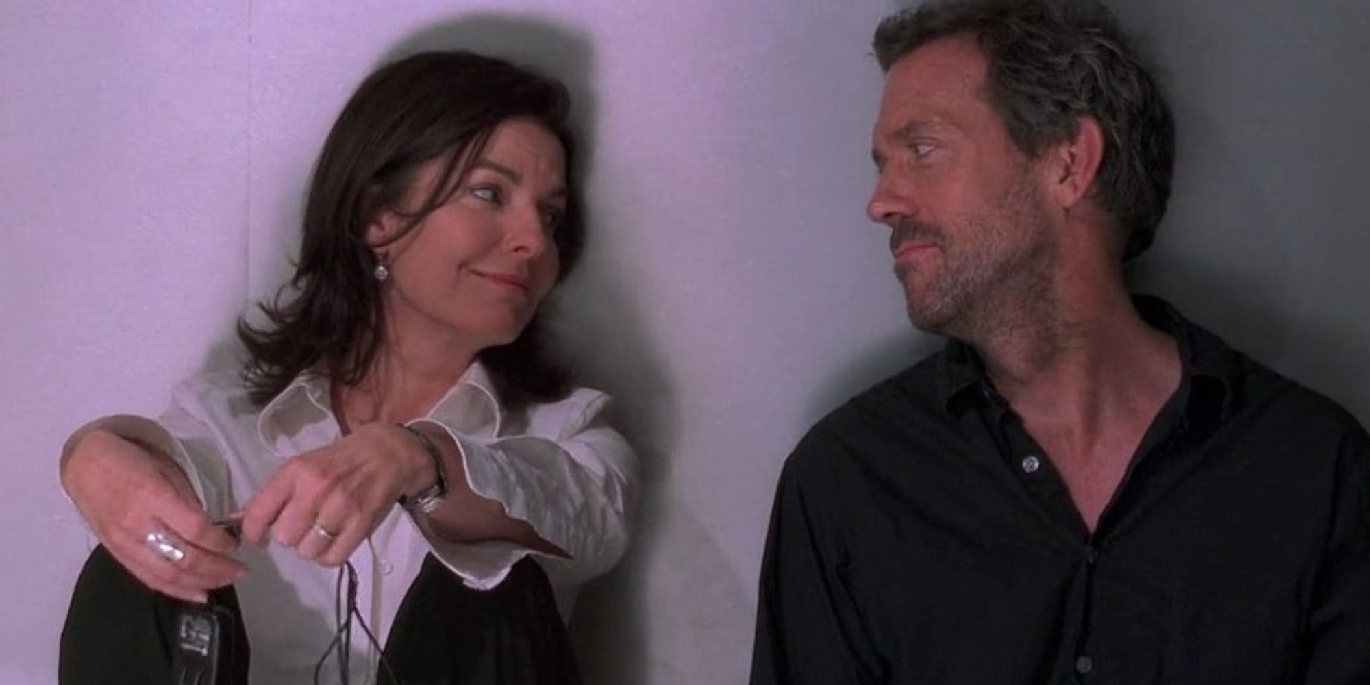 Stacy and House smiling at each other