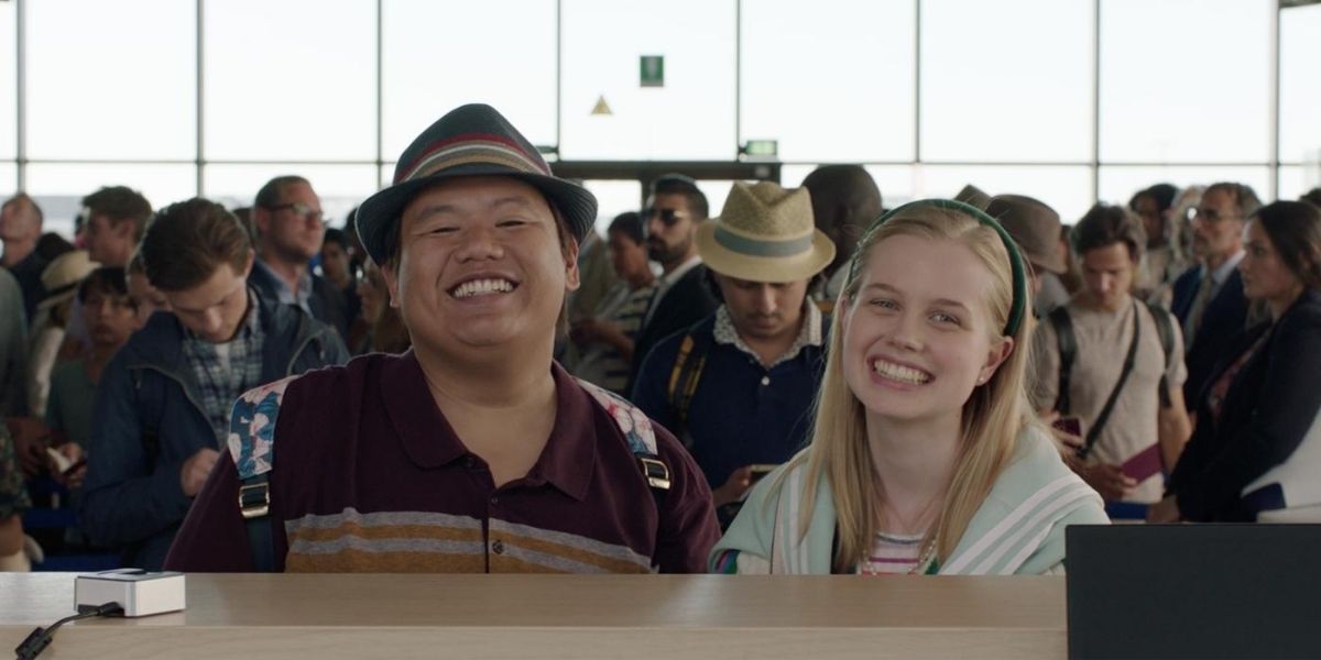 Ned and Betty smiling at someone off-camera in Spider-Man: Far From Home.