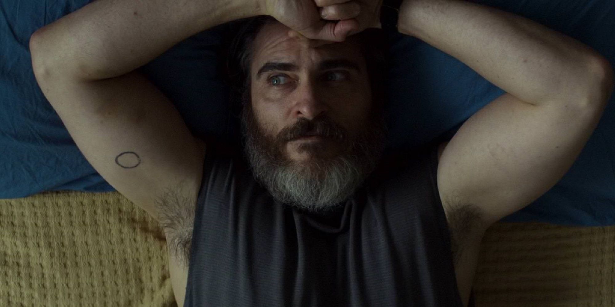 Joe laying in bed in You Were Never Really Here.