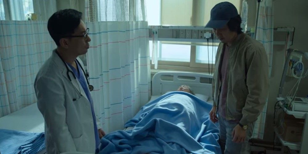 Lee Jung-jae as Seong Gi-hun in Squid Game in Hospital With Sick Mother