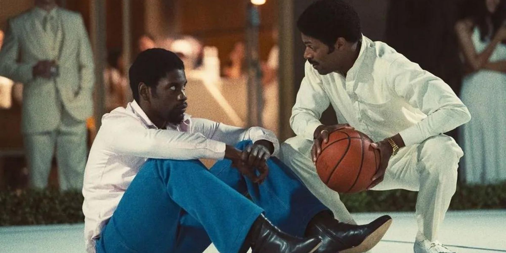 Magic and Norm Nixon all white at the pickup game in Winning Time