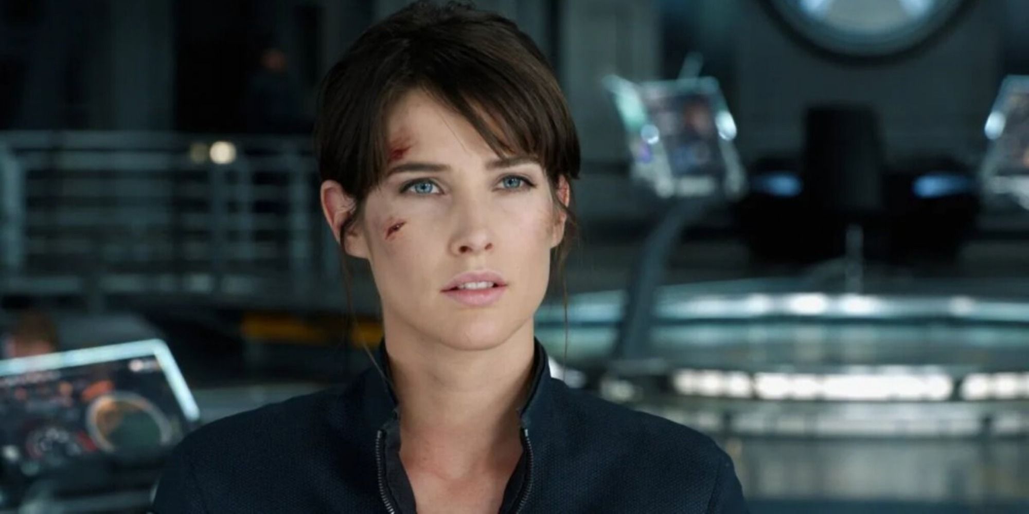 Maria Hill with scrapes on her face looking forward in The Avengers.
