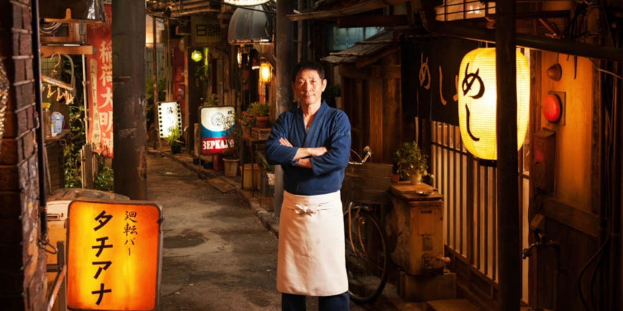 Kaoru Kobayashi as The Master standing in front of his restaurant in Japan in Midnight Diner.