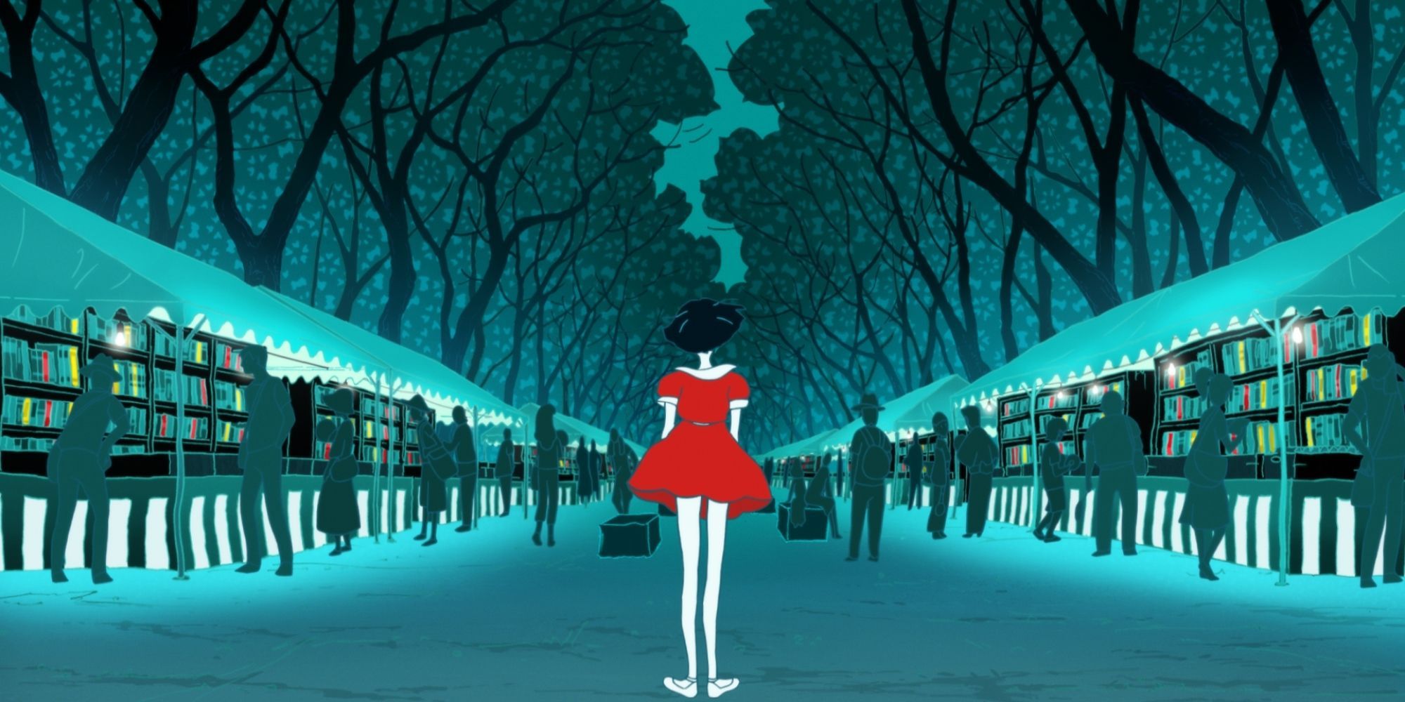 A girl in a red dress standing in the middle of a lan, with each side holding book stalls